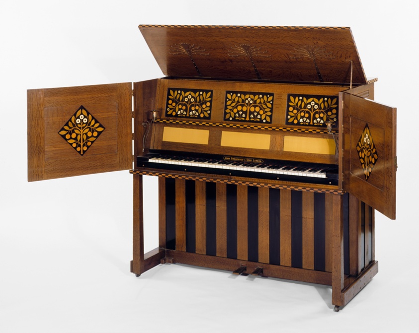 Wooden piano with cabinets inlaid with ivory and mother-of-pearl.
