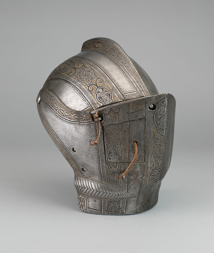 Steel helmet with brass stripe trim, leather ties.