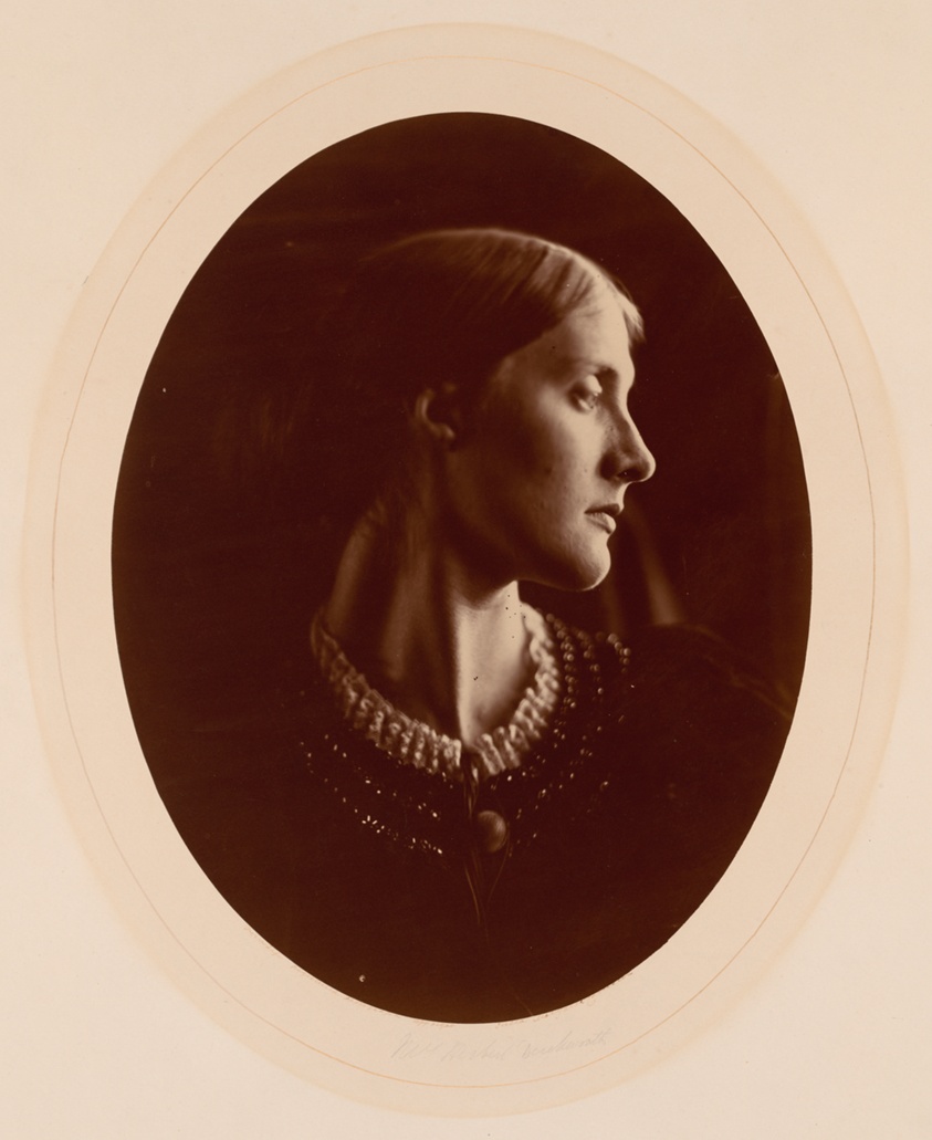 Black and white photograph of white woman, in profile, Victorian dress.