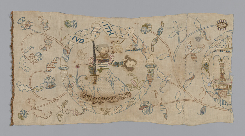 A work made of linen, plain weave; embroidered with silk, linen, and gilt-metal-strip-wrapped linen in back, a variety of buttonhole, chain, square chain, cross, long-armed cross, eyelet, herring bone, threaded herringbone, knotted, interlocking lace, overcast, running, double running, satin, and stem stitches; couching; edged with linen and gilt-metal-strip-wrapped linen bobbin lace.