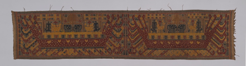 Large rectangle of fabric, geometric shapes depicting ship and people, in red, blue and yellow.
