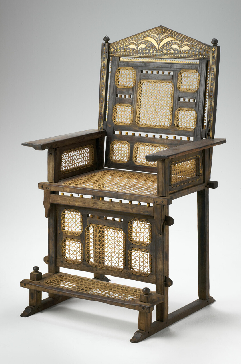 Wooden chair with woven cotton seat, back, footrest.
