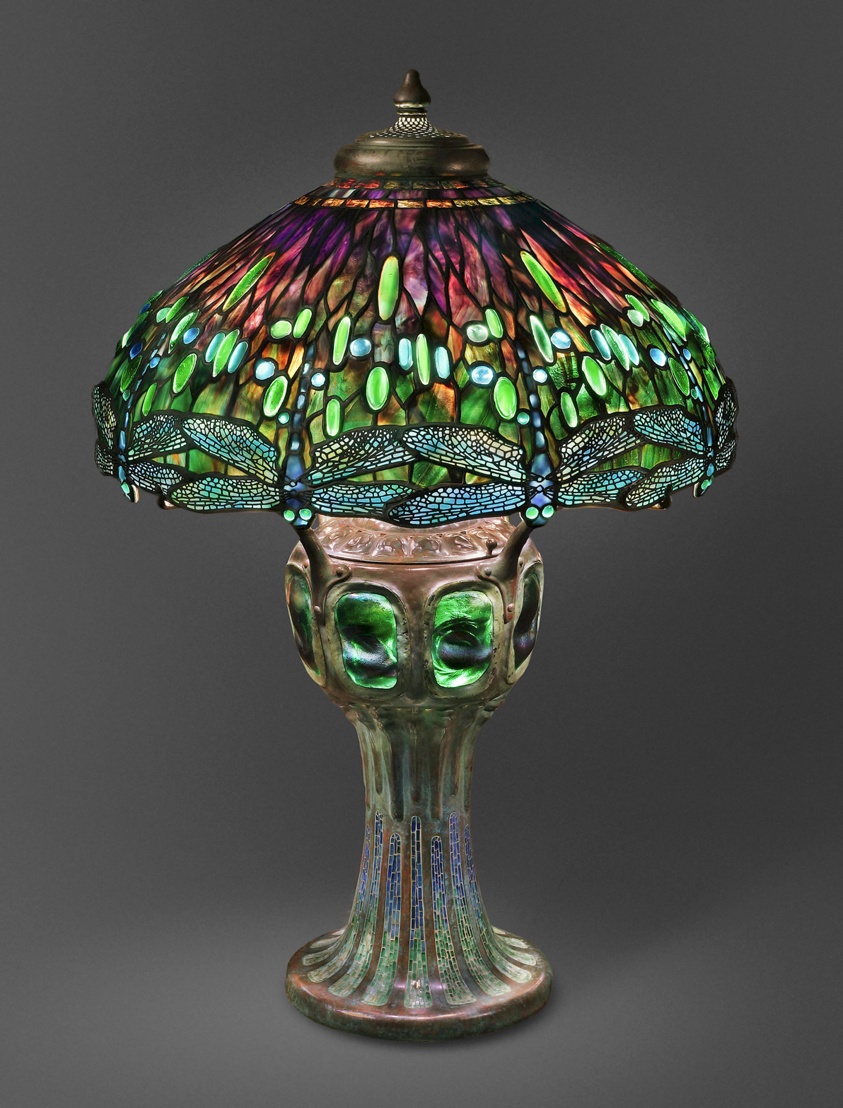 Lamp with stained glass shade featuring dragonflies and shades of green, purple, brown.