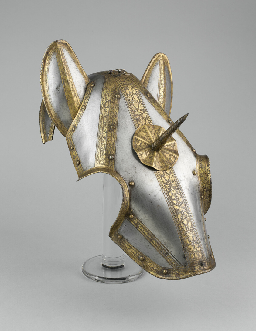 Steel horse helmet, brass trim, protruding spike.