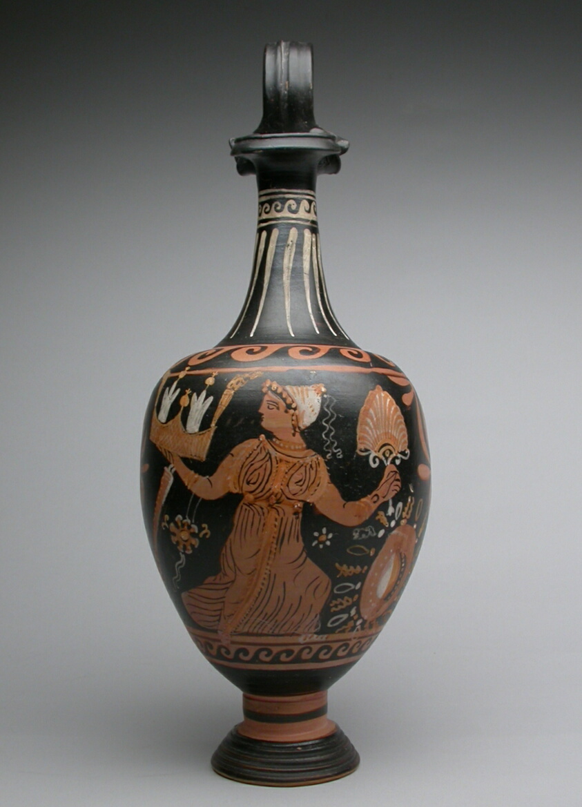 Terracotta pitcher decorated with red figures on a black background, with a slender neck and base. One side features a woman holding a fan; the reverse, a stylized fan pattern.