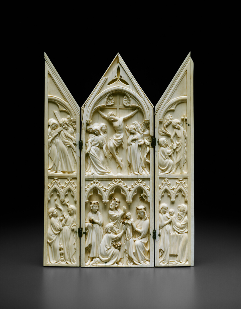 Three connected ivory panels carved with scenes from the life of Jesus.