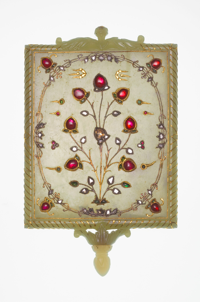 Tan jade frame with ruby, diamond, emerald flower designs.