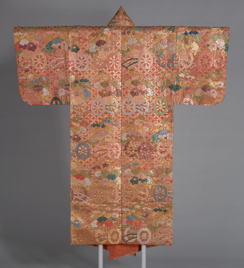 A work made of silk and gold-leaf-over-lacquered-paper strips, warp-float faced 2:1 'z' twill weave with supplementary patterning wefts; lined with silk, plain weave; dyed with safflower, beni.